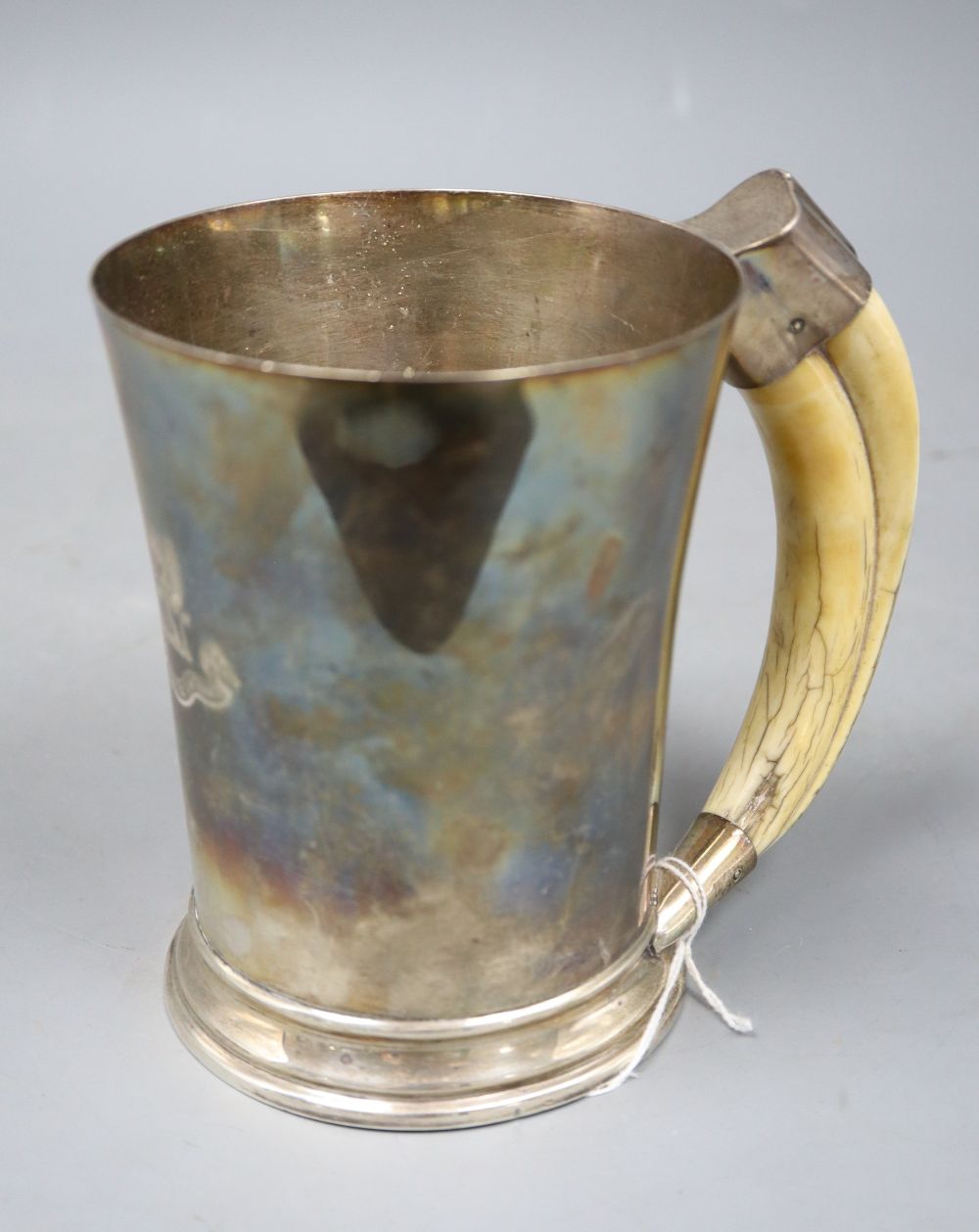A George VI silver mug with boars tusk handle, Goldsmiths & Silversmiths Co Ltd, Birmingham, 1941,